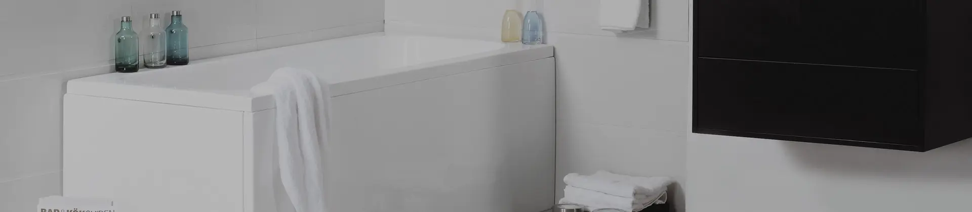 Bath with shower enclosure